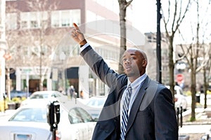 Business Man Hailing a Taxi Cab