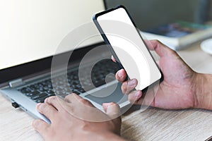 Business man hand holding smart mobile phone, using credit card for online shopping