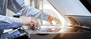 Business man Hand press button on panel of printer, printer scanner laser office copy machine supplies start