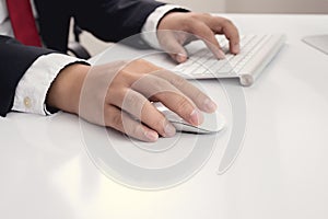 Business man hand using computer mouse