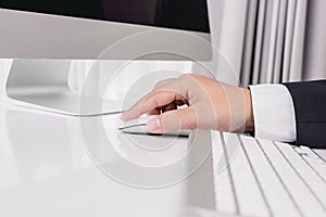 Business man hand using computer mouse