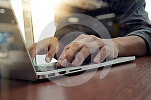 Business man hand working on laptop computer