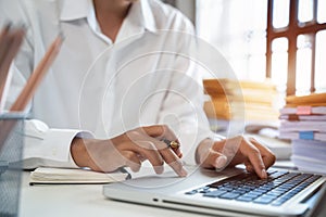 business man hand working with laptop computer, tablet and smart phone in office