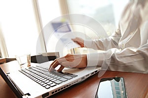 Business man hand working on laptop computer