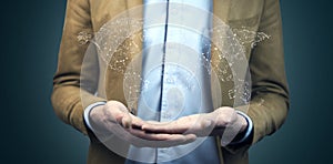 Business man hand world map in screen