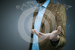 Business man hand world map in screen