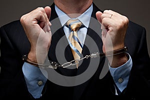 Business man in handcuffs