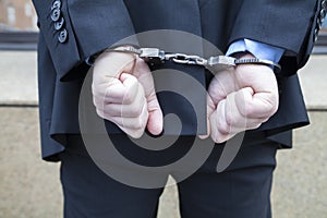 Business man in handcuffs