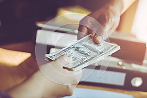 Business man handing money over a business dealing photo