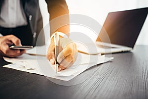 Business man hands busy using cell phone at office desk