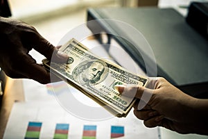 Business man hands handing money over business meeting photo