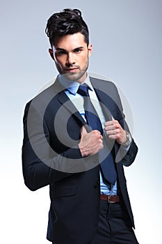 Business man with hands on lapels