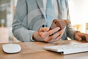 Business man, hands and phone app at desk with networking, text and online communication. Computer, mobile message and