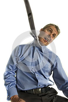 Business man hanging from tie