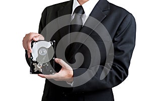 Business man hold harddisk in isolated