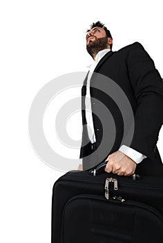 Business man holding brief case and walking