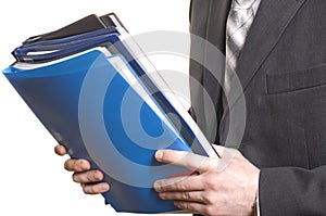 Business man holding files and folders