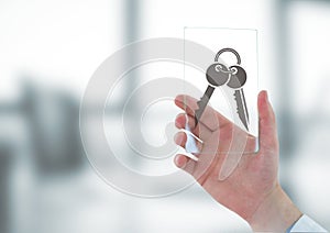 Business man holding a glass with keys icons