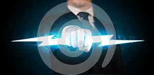 Business man holding glowing lightning bolt in his hands