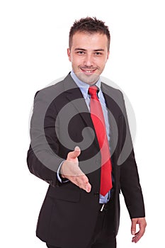 Business man holding his hand up for a handshake