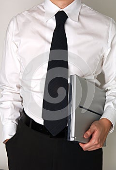 Business man holding a laptop