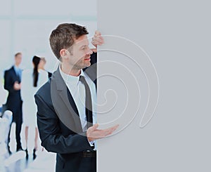 Business man holding a long blank banner.