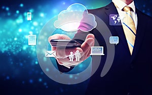 Business man holding a mobile phone with cloud connection theme