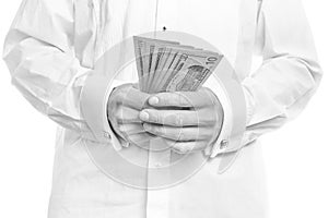 Business man holding money on white background