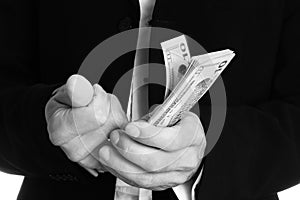 Business man holding money on white background