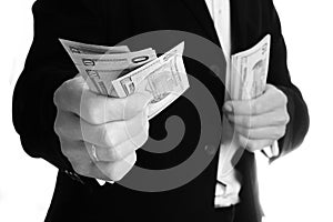 Business man holding money on white background