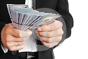 Business man holding money on white background