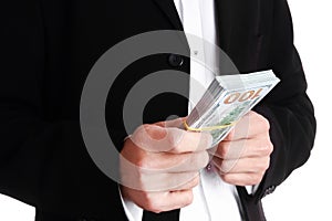 A Business man holding money on white background