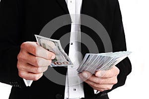 A Business man holding money on white background