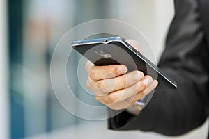 Business Man Holding Phablet Smartphone And Watching E-mail