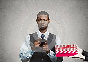 Business man holding smart phone, doesnt pay attention on surroundings