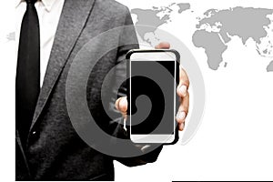 Business man holding smart phone with world map graphic