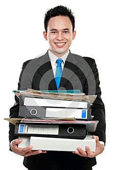 Business man holding stack of files and folders