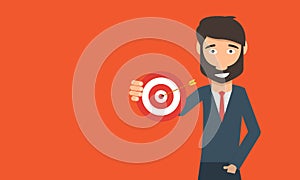 Business man holding target to success concept.