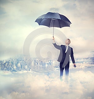 Business man holding an umbrella
