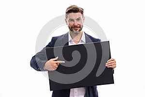 Business man holds sign, blank card. Placard ready for your product. Man in suit showing blank sign board over studio