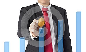Business man invest in gold egg