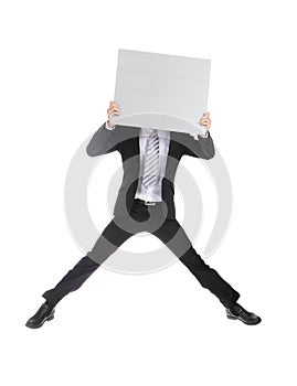 Business man jumping and holding billboard