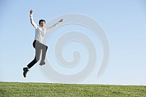 A business man jumping for joy