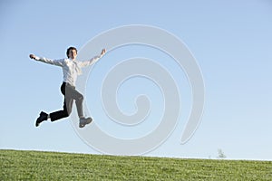 A business man jumping for joy