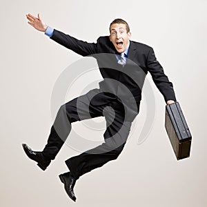 Business man jumps in the air