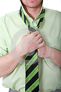 Business Man knotting tie