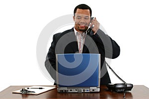 Business Man with Laptop on Phone