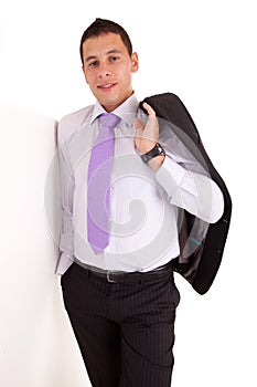 Business man leaning against wall