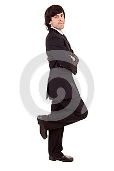 Business man leaning against wall