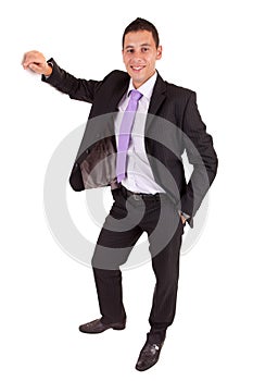 Business man leaning against wall